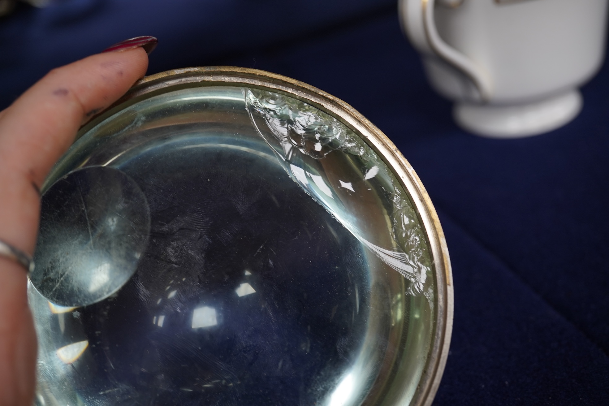 A large oversized spherical glass encased desk timepiece, with four subsidiary dials, 16cm